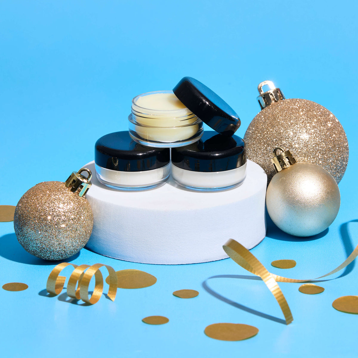 jar of solid perfume in a holiday setting