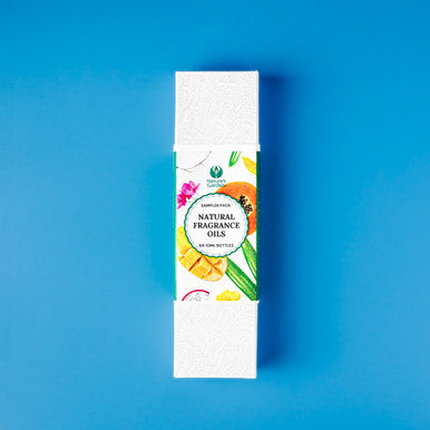 Box of natural fragrance oils on a blue background