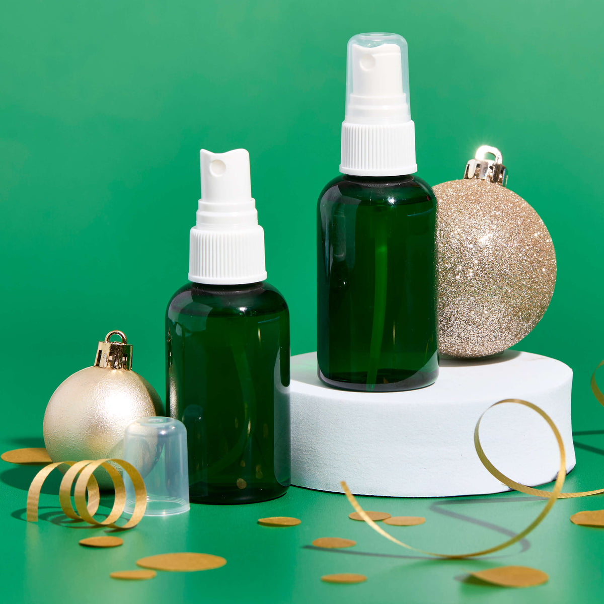 bathroom spray in green bottles