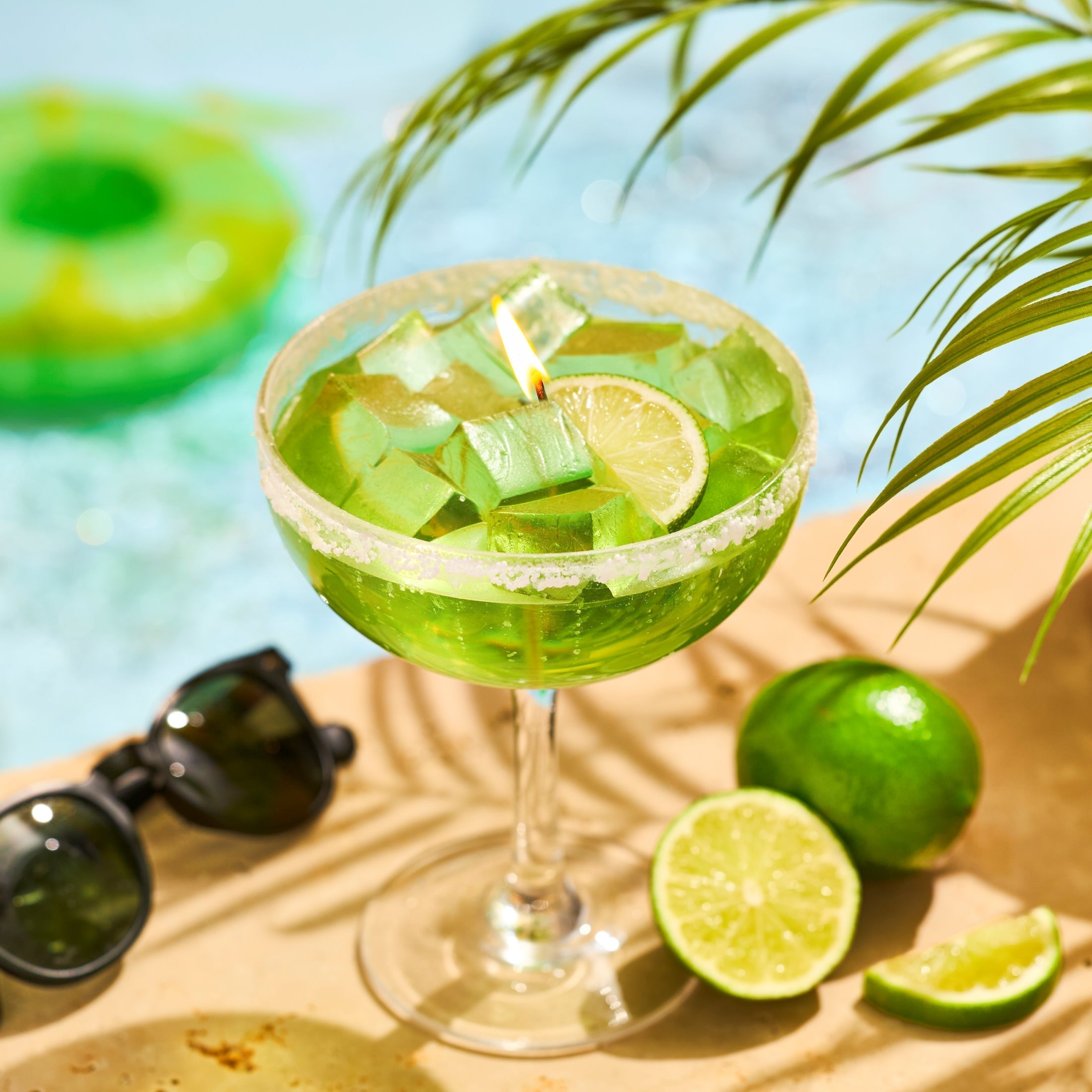 margarita gel wax candle next to a pool