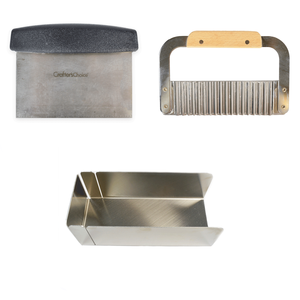 Three metal soap making tools on a white background