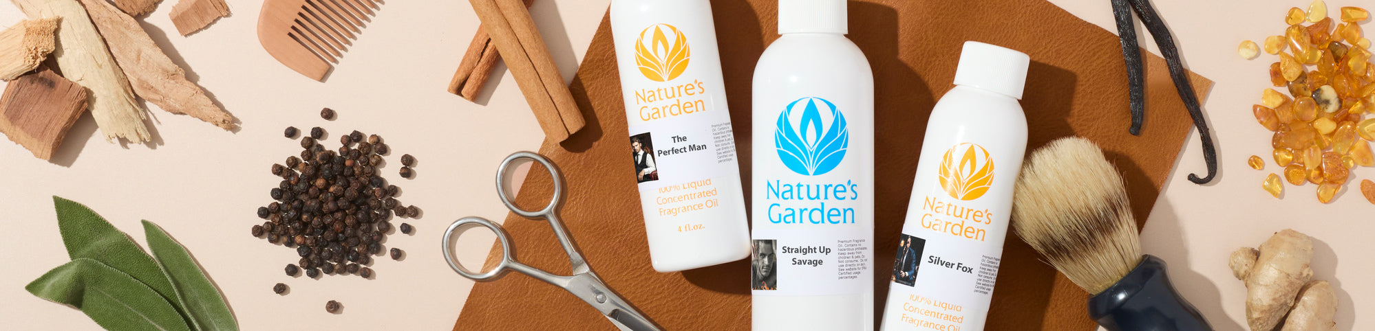 Flat lay of Nature’s Garden fragrance oil bottles with barber tools and spices, including scissors, shaving brush, comb, cinnamon sticks, vanilla beans, peppercorns, and ginger on a leather surface.