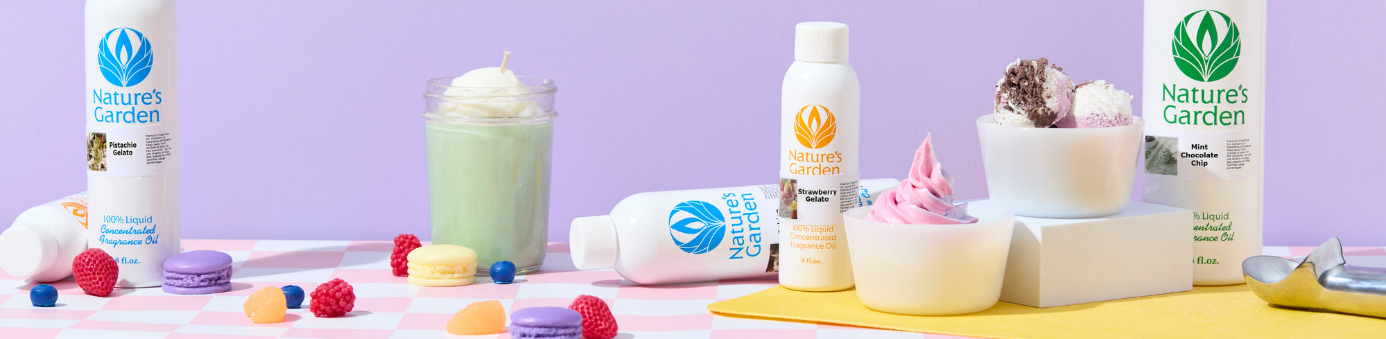 Nature’s Garden fragrance oil bottles displayed with dessert-inspired scents, surrounded by gelato, ice cream scoops, pink soft serve, macarons, berries, candy, and an ice cream scoop on a pastel pink-and-lavender set.